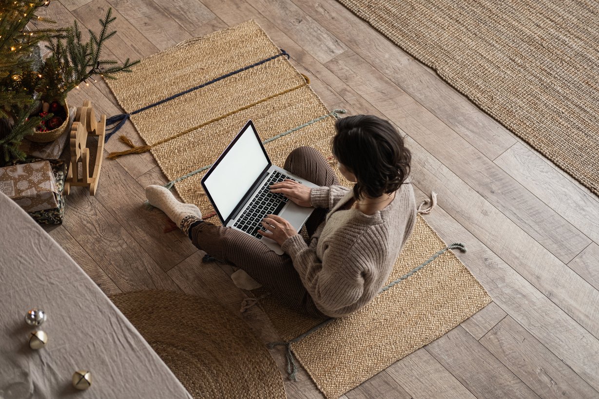 Woman Working with Laptop on Holidays 